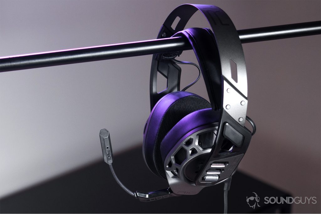 The headphones suspended from a black bar.