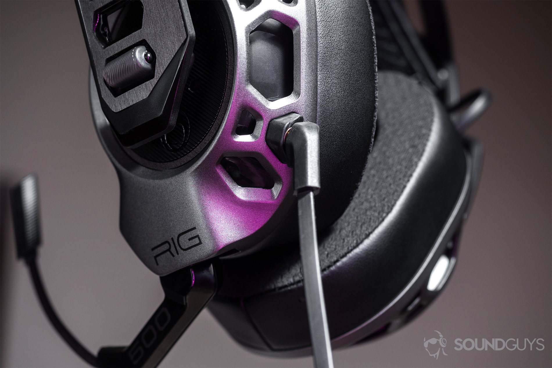 An upward image of the 3.5mm input and the angled jack plugged in. It also depicts the geometric design of the ear cups.