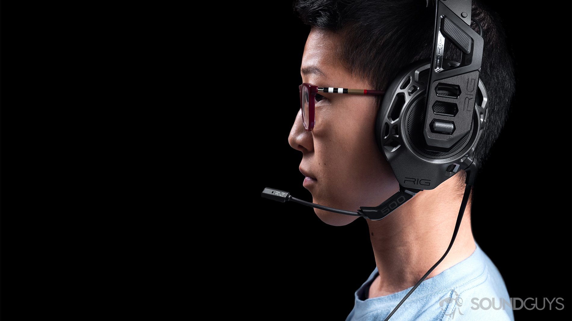 Gaming headset: The profile of a woman wearing the headphones with the boom mic close to the lens.