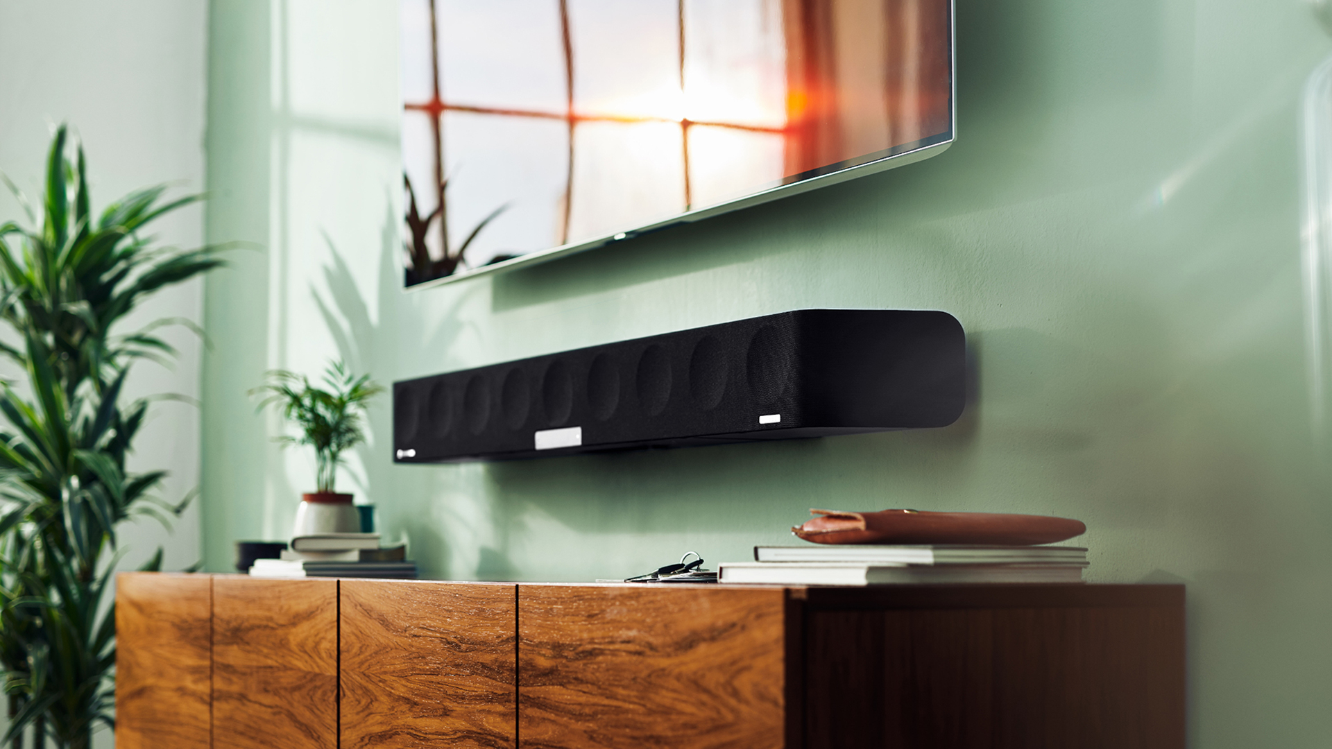 Pictured is the Sennheiser Ambeo soundbar mounted to a wall
