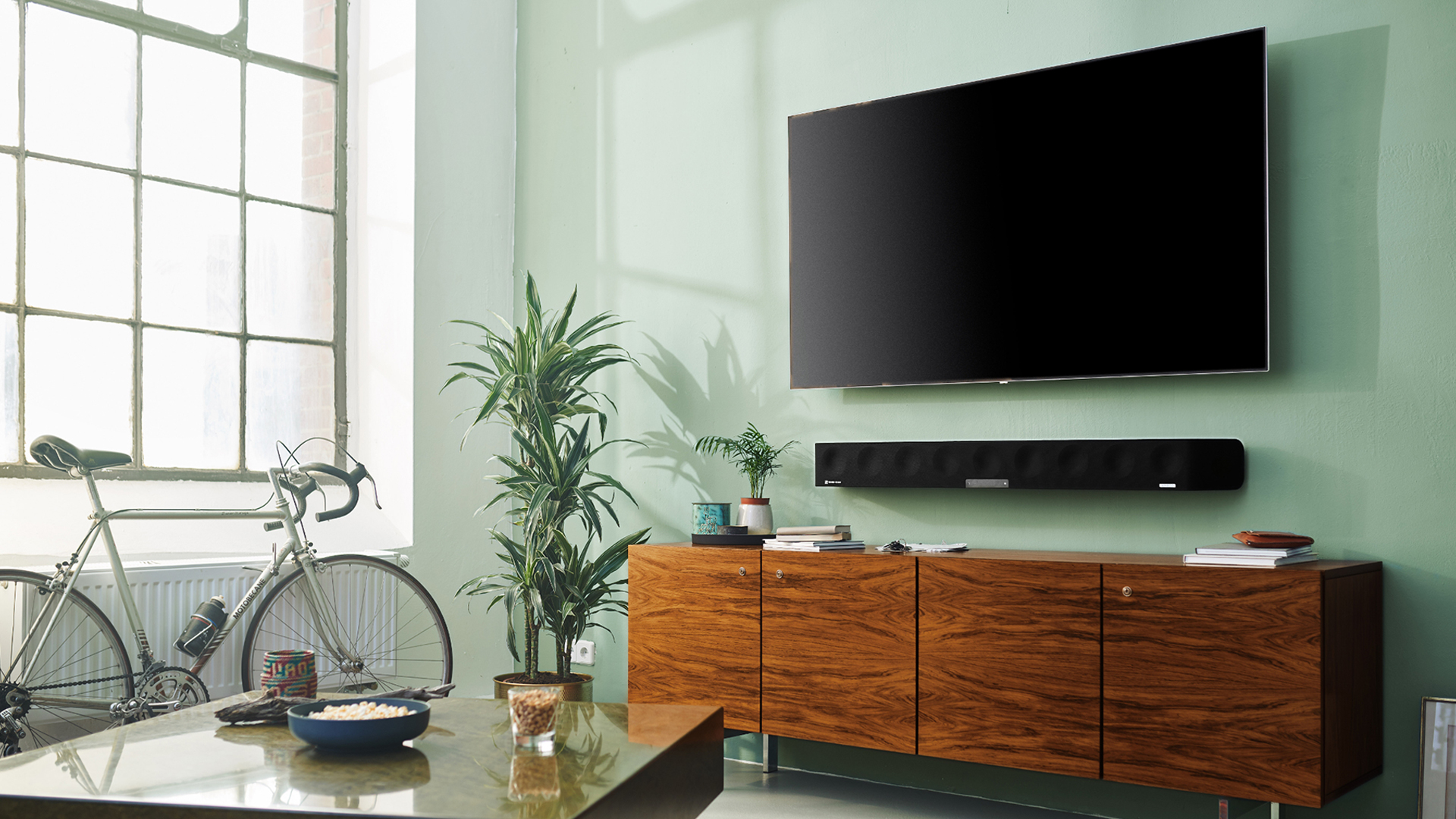 A shot of the Sennheiser Ambeo soundbar in a living room.