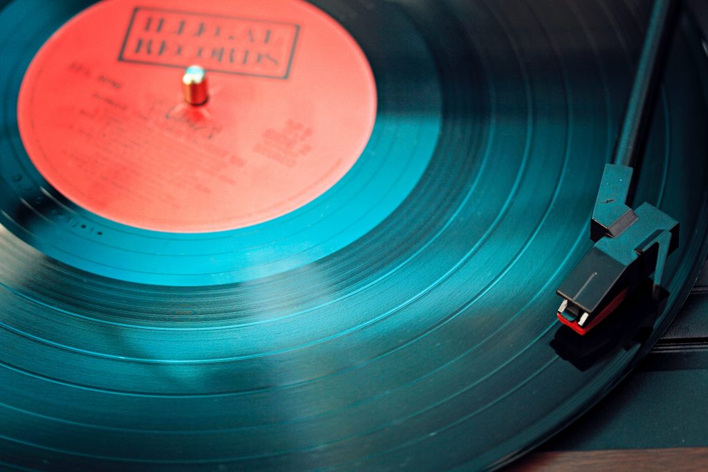 Vinyl: A photo of a record on a turntable.