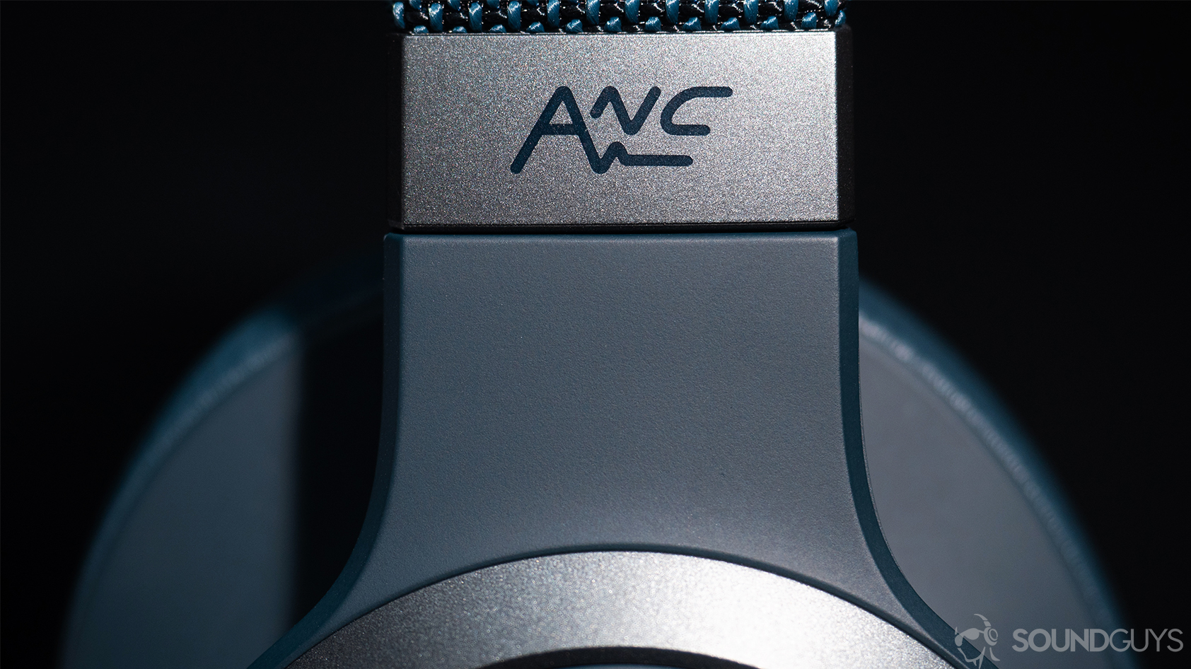 The JBL Live 650BTNC noise canceling headphones' close-up of ANC writing on the headband.