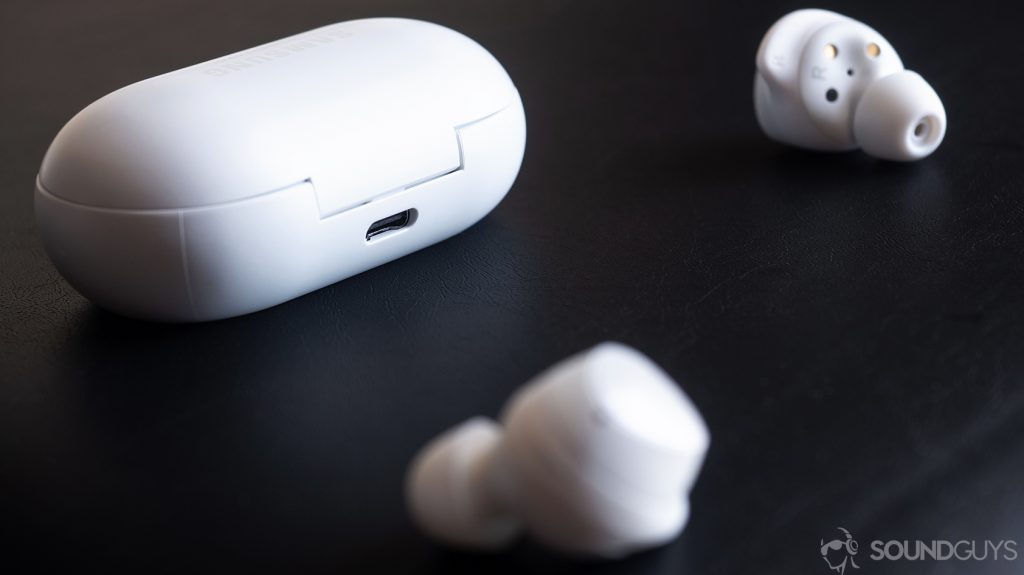 Samsung Galaxy Buds: The earbuds in front of the charging case with the USB-C input showing.