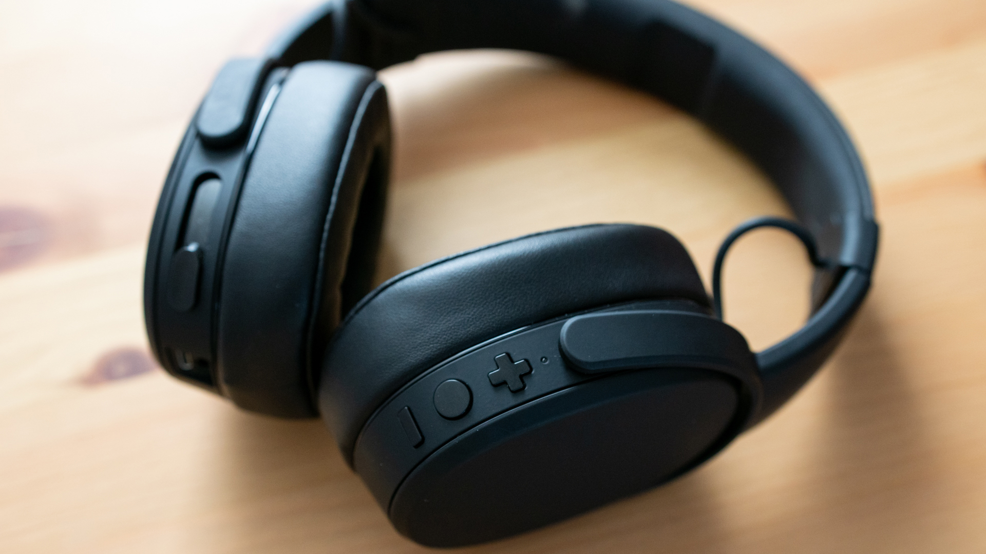 Shot of the Skullcandy Crusher Wireless flat on a desk.