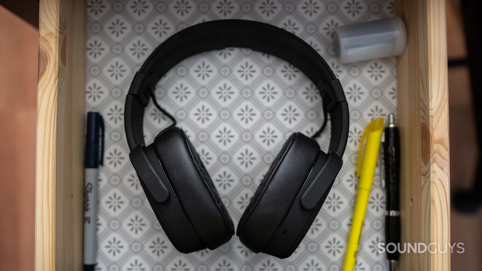 The Skullcandy Crusher Wireless headphones in a drawer.