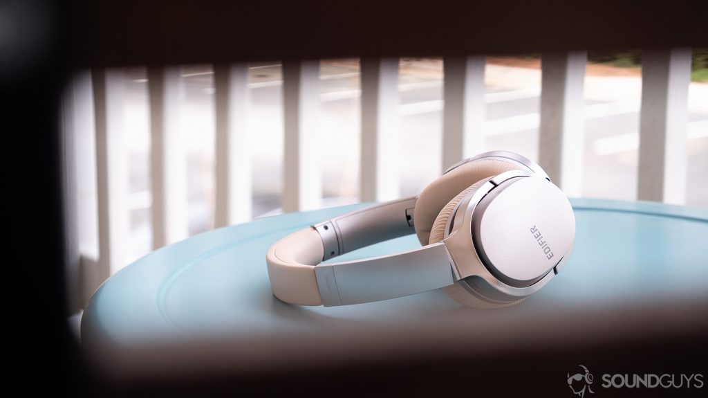 best earbuds under $50 - Edifier W860NB: The headphones on a teal table.