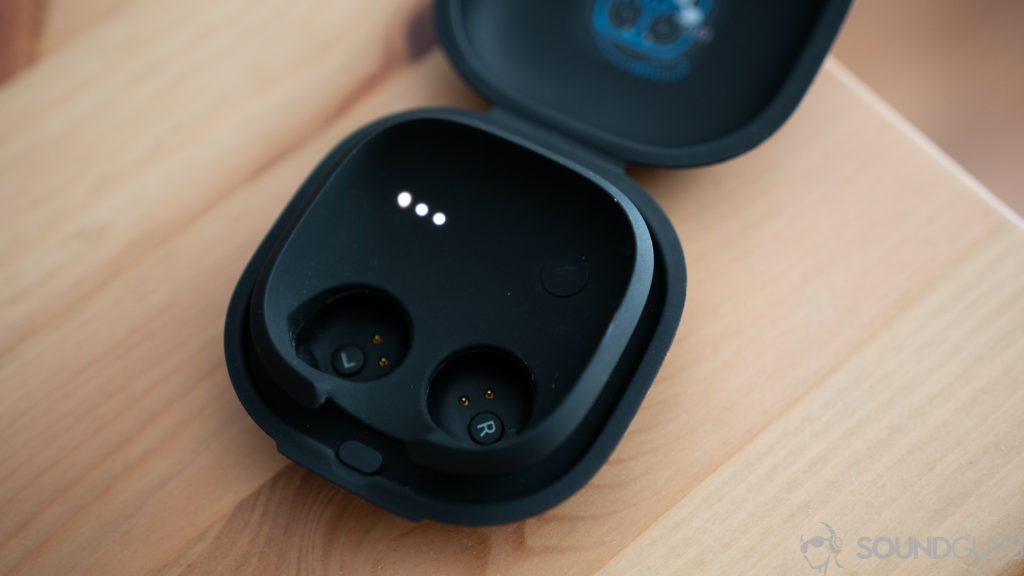 The charging case of the Google Pixel Buds open on a table.