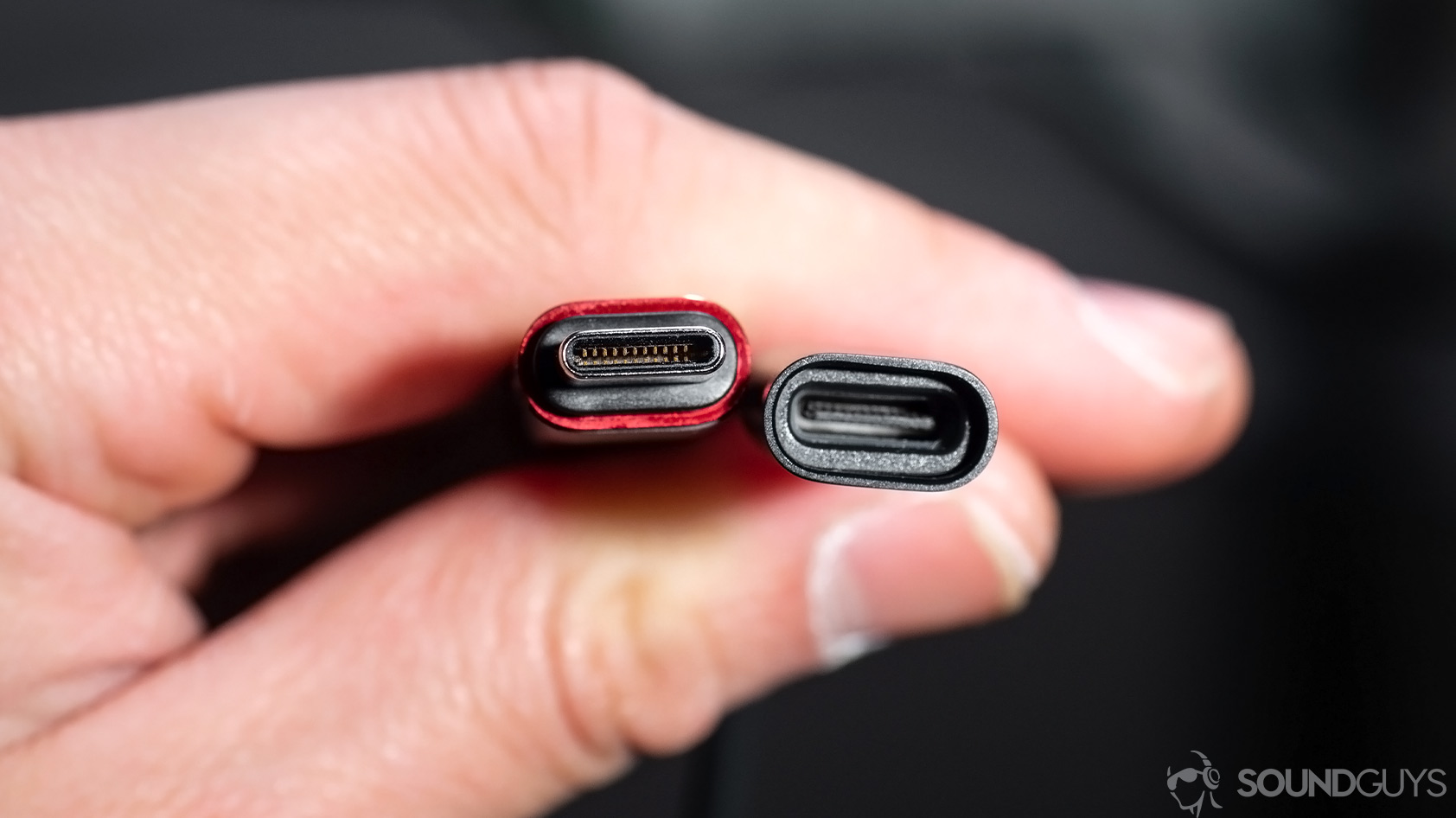 Huawei_FreeLace-6-USB C separated Huawei Freelace: A close-up of the USB-C module built into the neckband. The pieces are held in a hand to show the male and female ends.