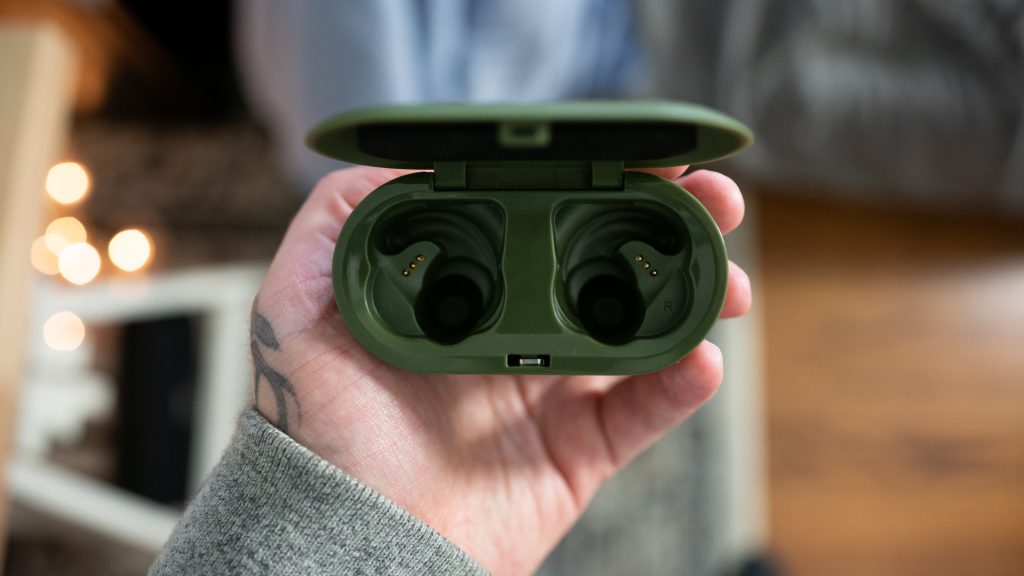 The charging case of the Skullcandy Push true wireless earbuds in hand.