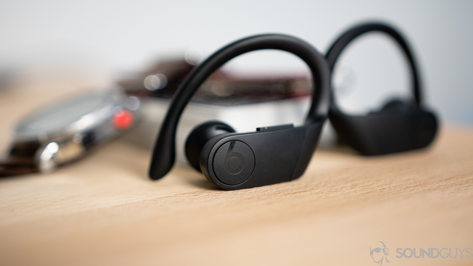 The playback control buttons on the Beats Powerbeats Pro.