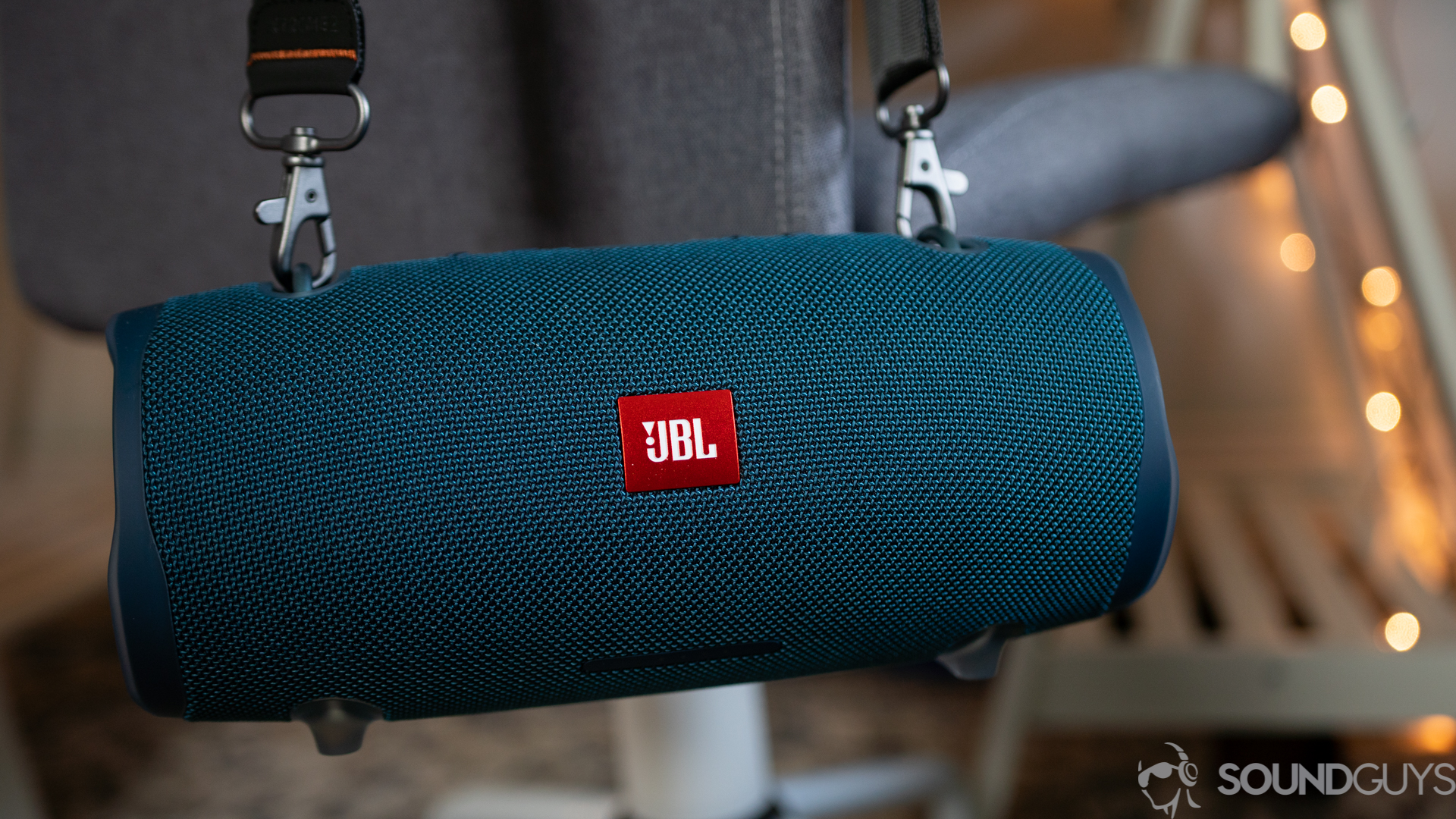 JBL Xtreme 2-6 Shot of the JBL Xtreme 2 hanging from a gray chair thanks to the strap.