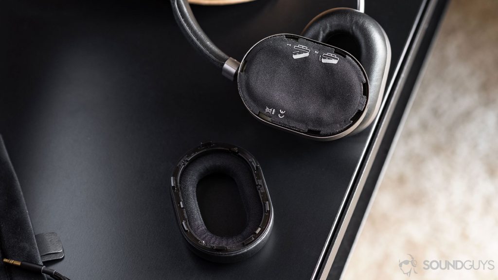 Master & Dynamic MW65: Removable ear cup on a table, showing bare headphone.