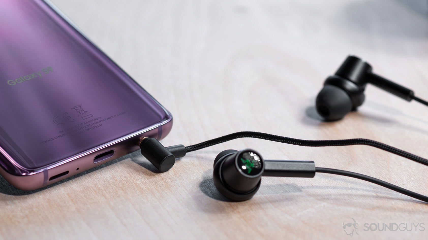 The L-shaped 3.5mm headphone jack inserted into a Samsung Galaxy S9 in Lilac.