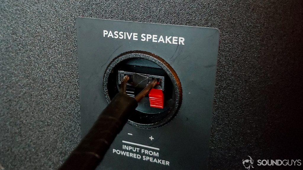 A photo showing the coathanger speaker cable connected to an unpowered speaker.