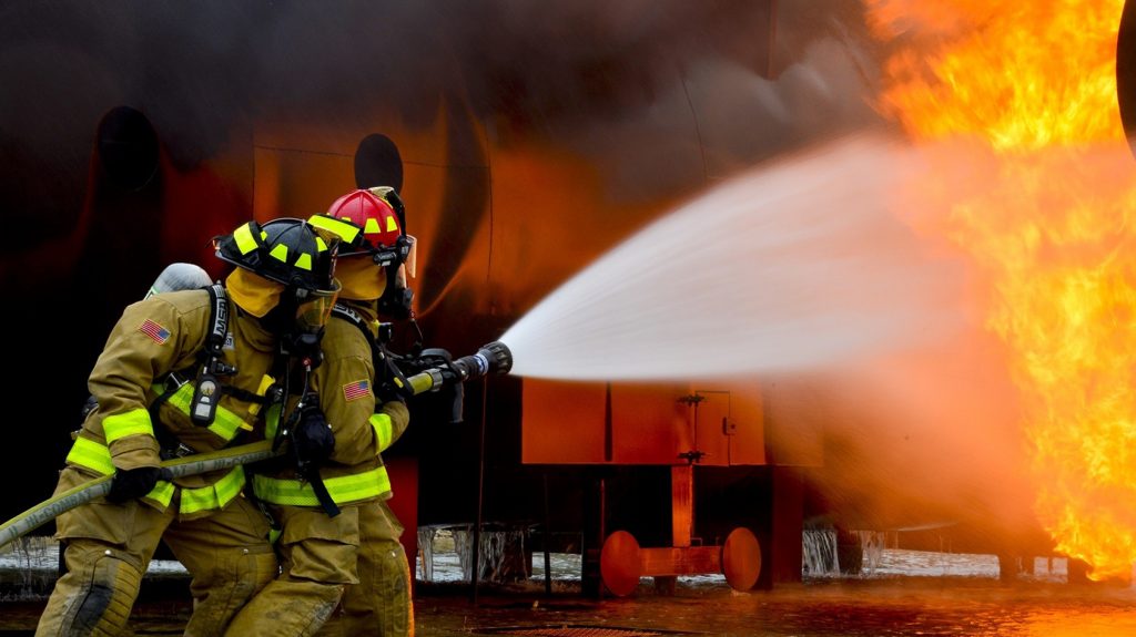 A photo of firefighters battling a fire.