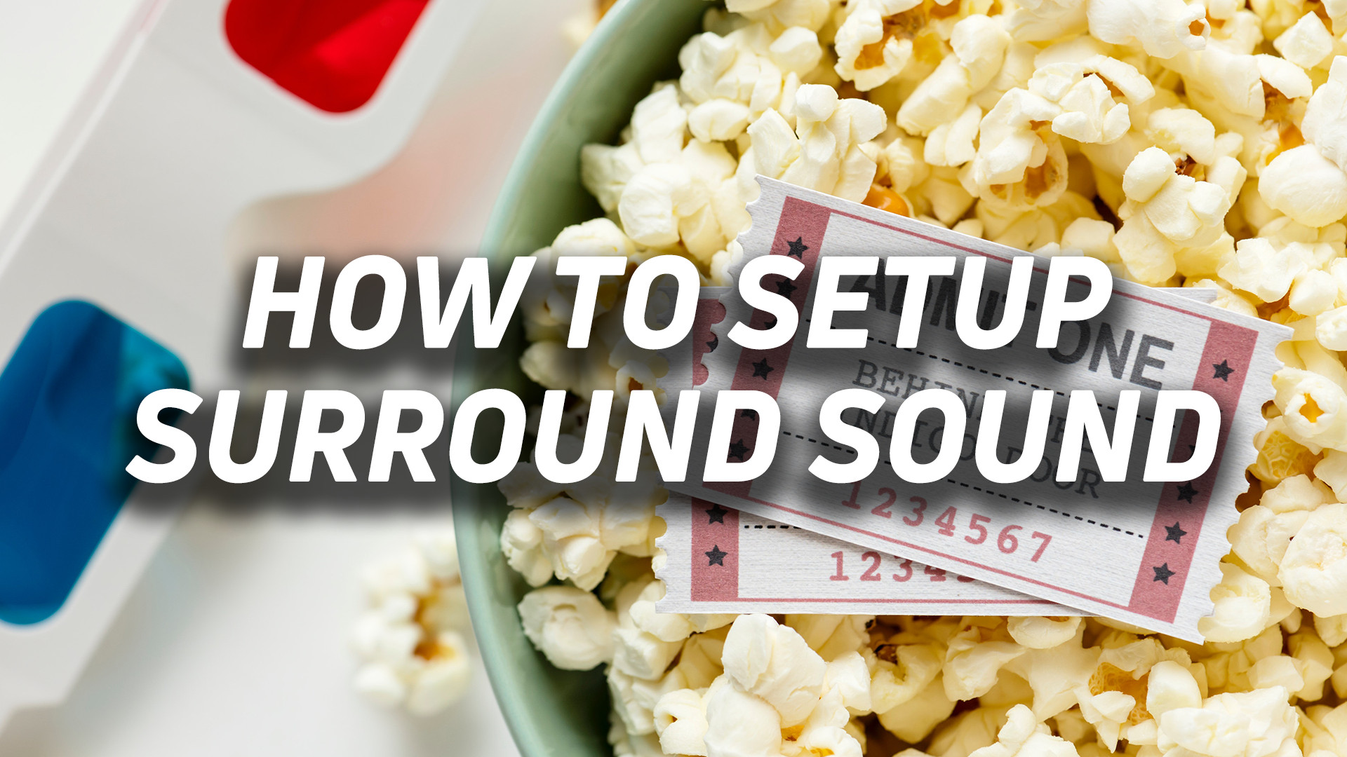 How to setup surround sound-hero popcorn bowl with movie tickets and 3D glasses off to the side. The overlayed text reads, "how to setup surround sound."