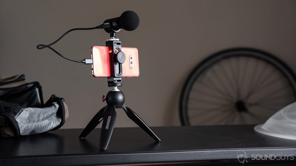 A picture of the Samsung Galaxy S10e clipped into the Manfrotto Pixi tripod with the Shure video kit microphone, a runner-up for the best mics for YouTube list, attached.