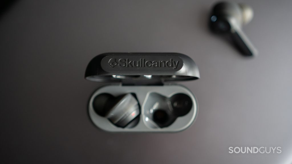 Top-down shot of the open Skullcandy Indy True Wireless charging case showing the cutouts for each earbud.