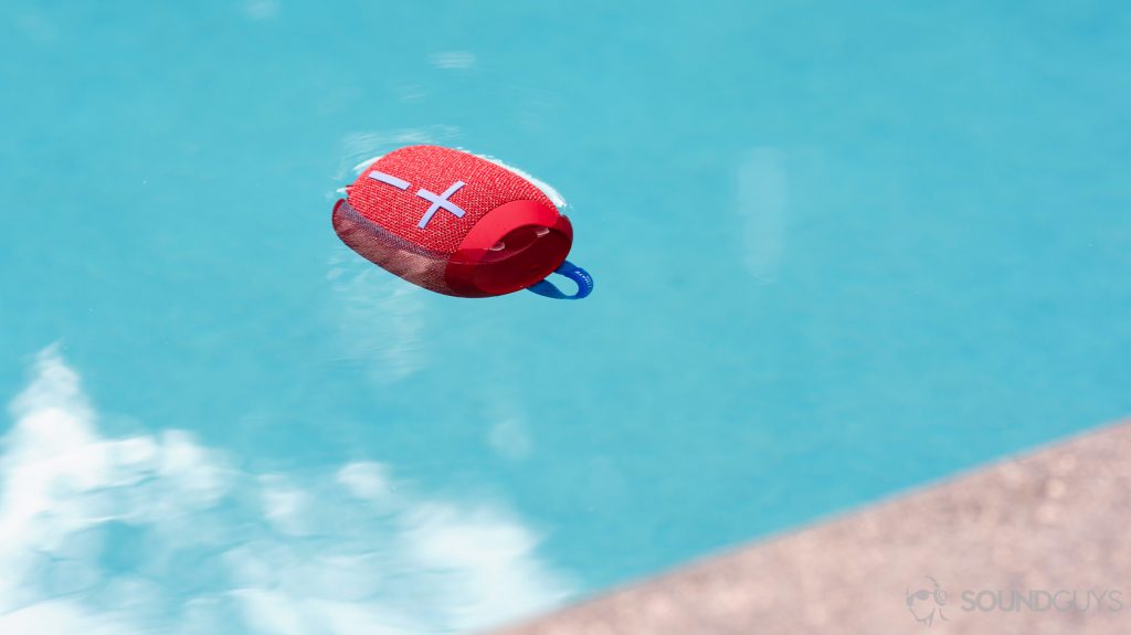 The UE Wonderboom 2 floating in a pool. The speaker is in red.