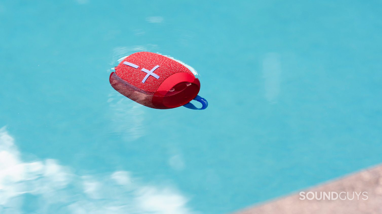 UE Wonderboom 2 floating in a pool. The speaker is in red.