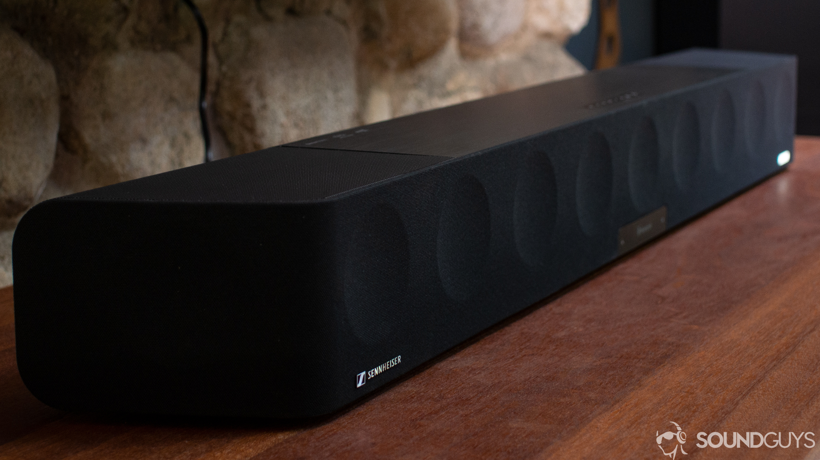 The Sennheiser Ambeo Soundbar on a wooden desk.