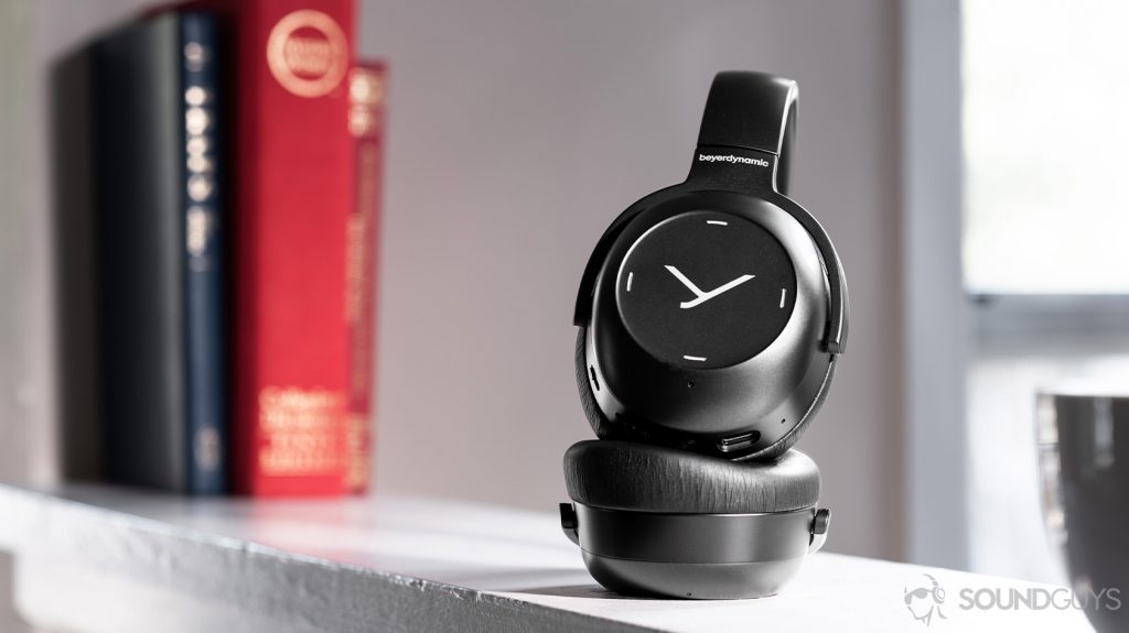 A picture of the Beyerdynamic Lagoon ANC headphones partially folded with the right ear cup facing the lens. It has markings indicating touch controls.