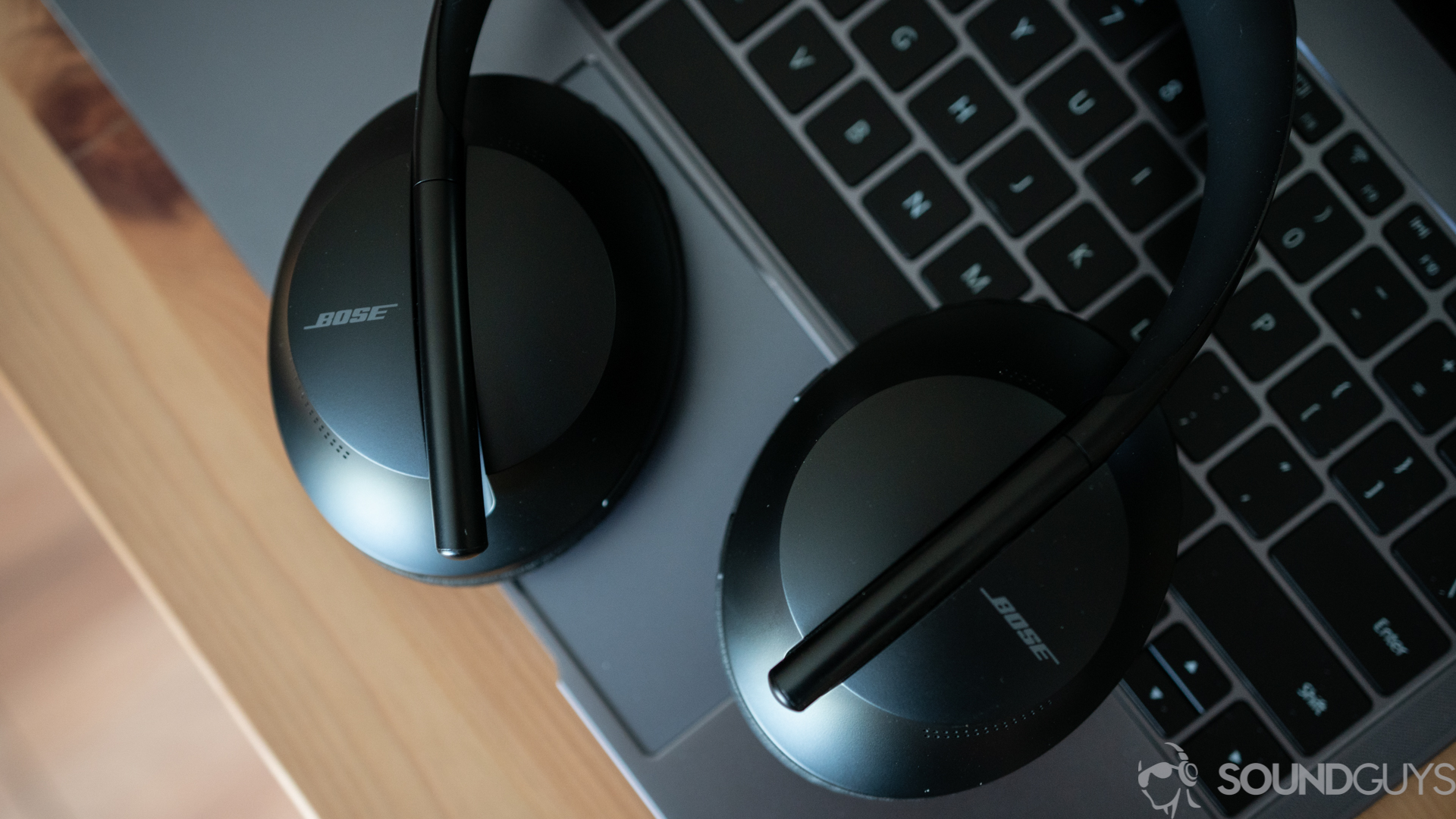 Pictured are the Bose Noise Cancelling Headphones 700 on top of the keyboard of a Huawei Matebook 
