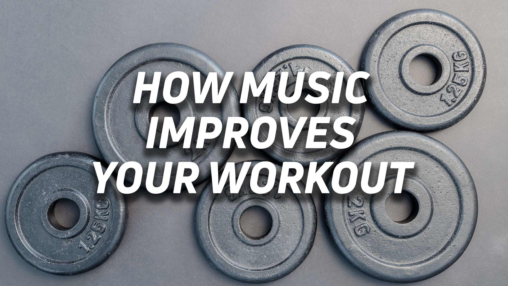 Aerial view of free weights with the text "how music improves your workout" overlaid.