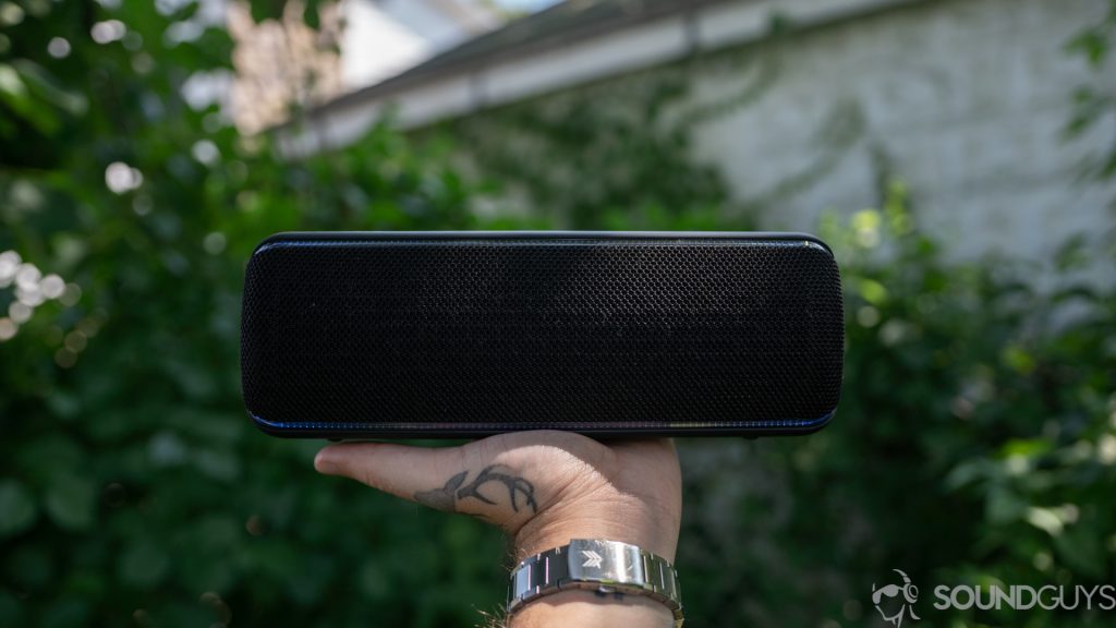 Adam holding the Sony SRS-XB32 Bluetooth speaker in hand. 