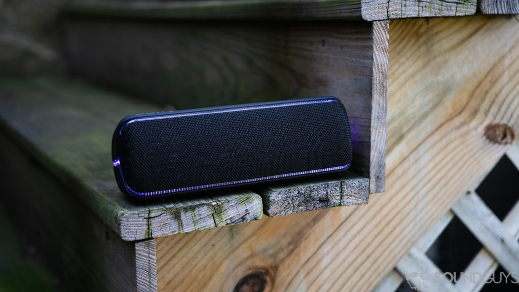 A photo of the Sony SRS-XB32 Bluetooth speaker sitting on wooden stairs.