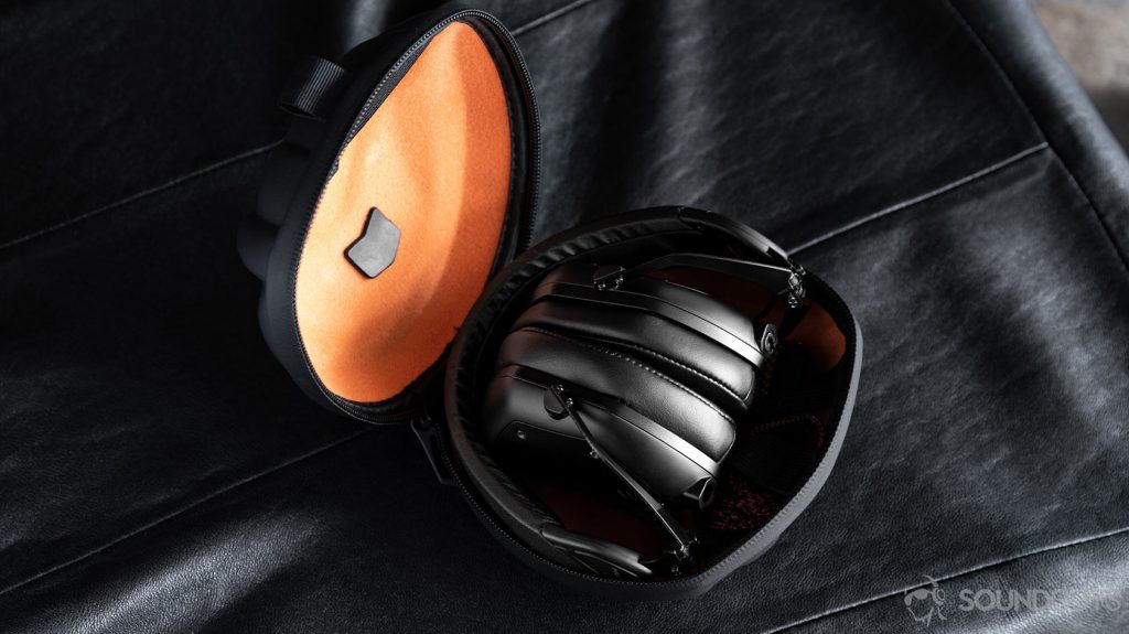 A picture of the V-Moda M-100 Master headphones collapsed and in the hard, clamshell carrying case.