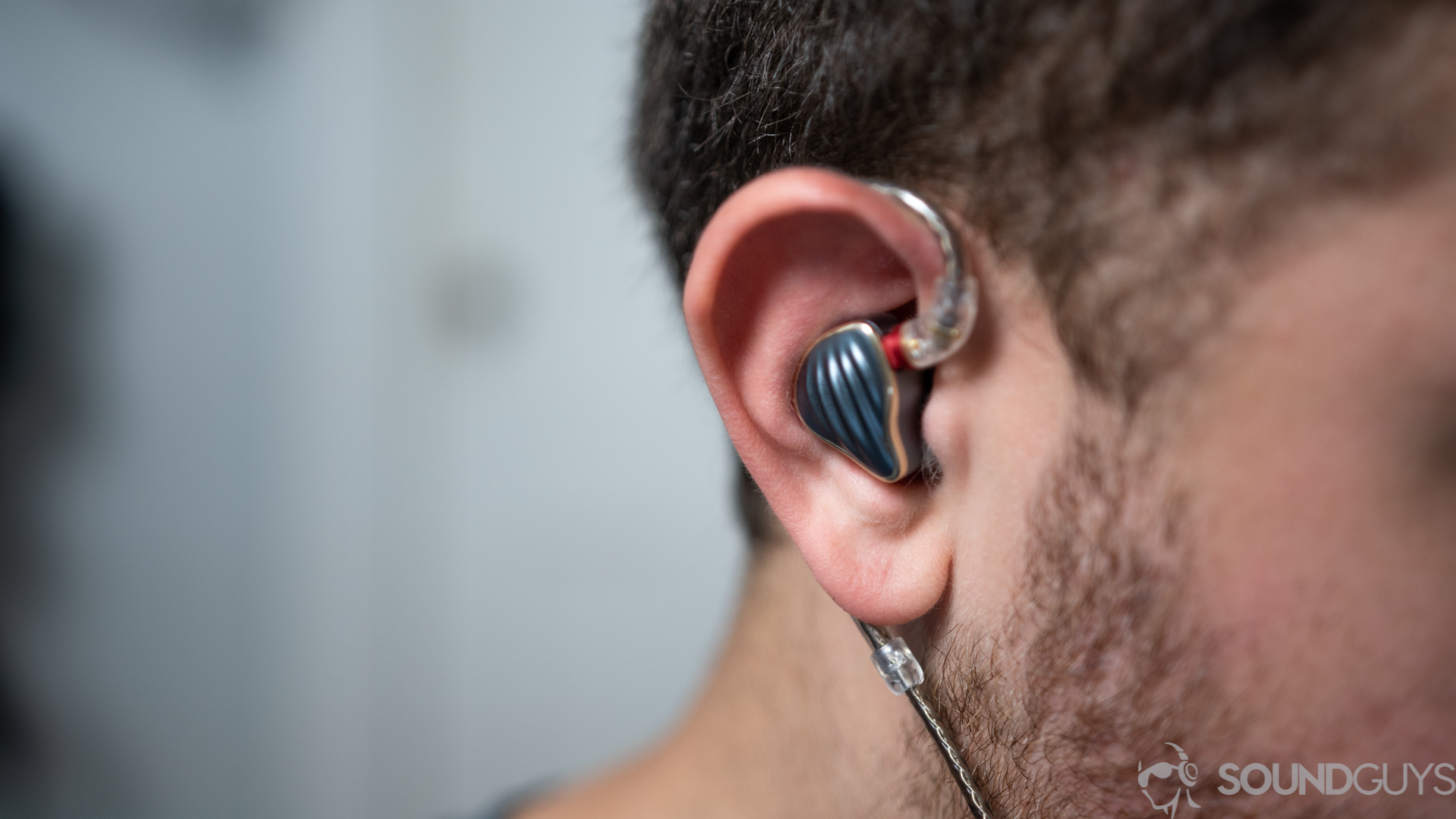 An image of a man wearing the Fiio FH5 in-ear monitors.
