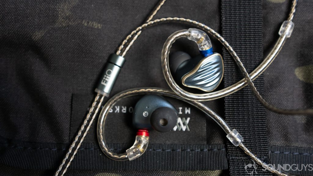 A photo of the FiiO FH5 in-ears on a backpack.