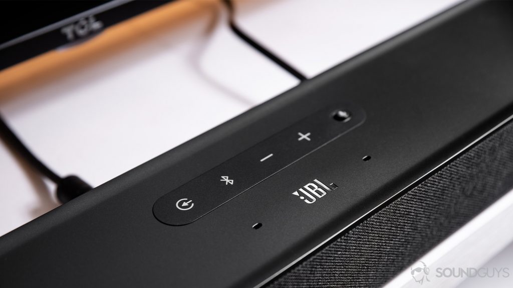 The JBL Link Bar control panel on the top of the soundbar above the JBL logo.