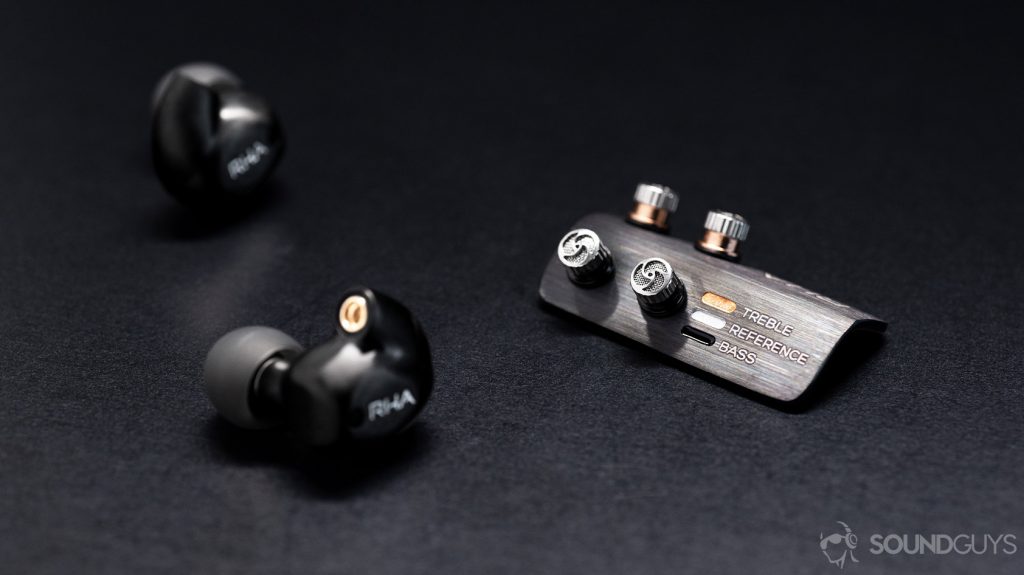 The RHA T20 Wireless detachable earbuds next to the included filter holder.