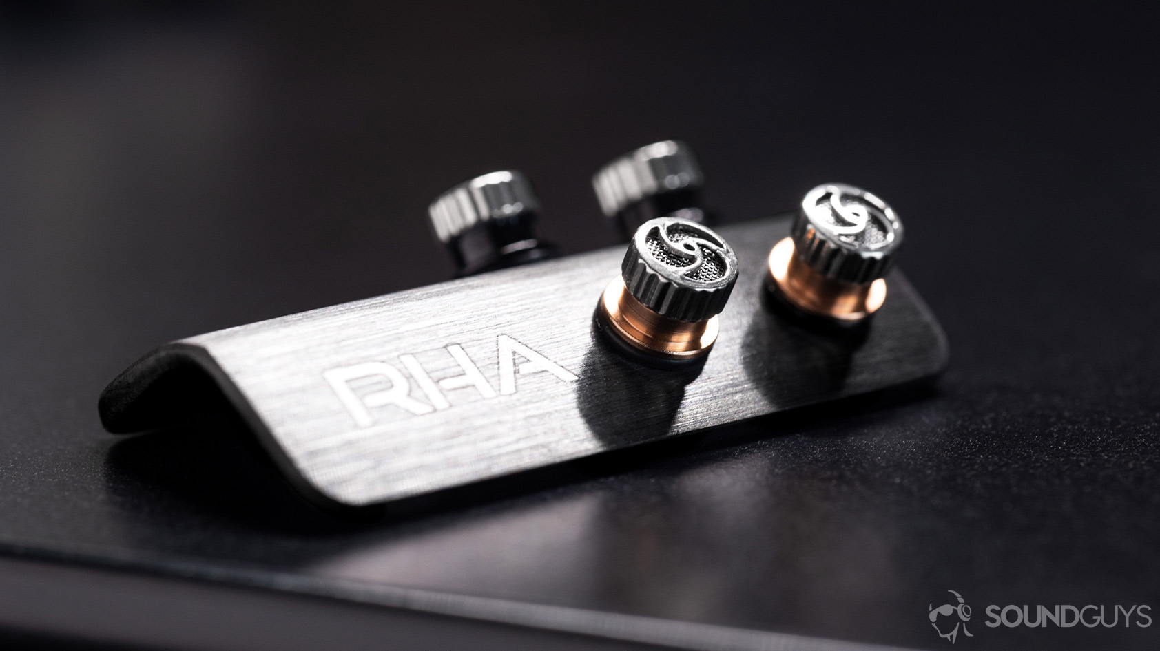 Close-up of the RHA T20 Wireless aluminum filter holder with the bass and treble filters screwed in.