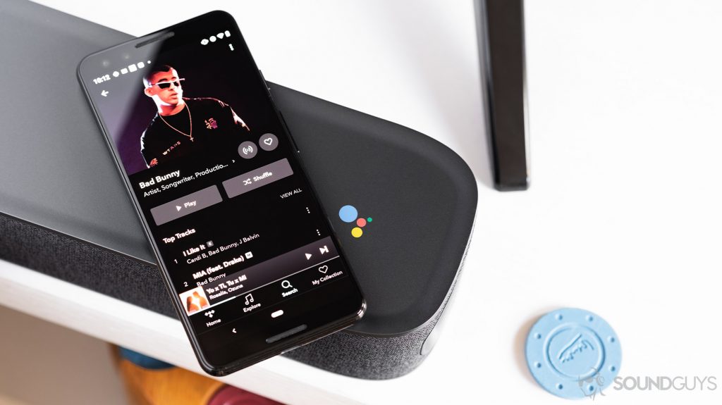 Aerial image of a Google Pixel 3 on a JBL Link bar. The Tidal HiFi app is open on the smartphone.