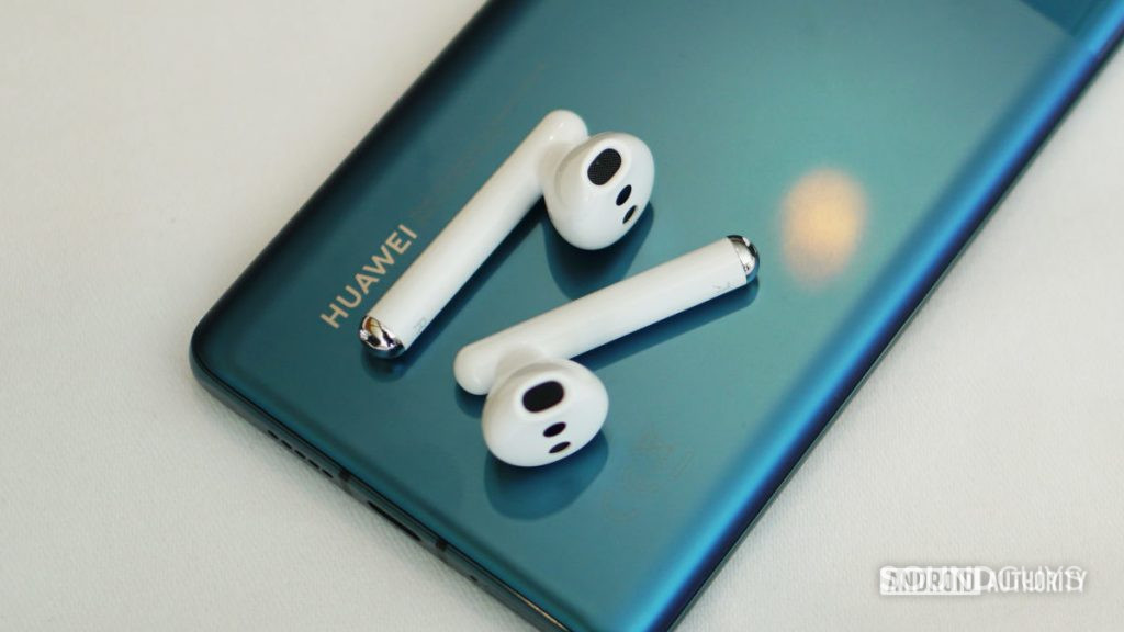 Huawei FreeBuds 3, sitting atop a Huawei phone.