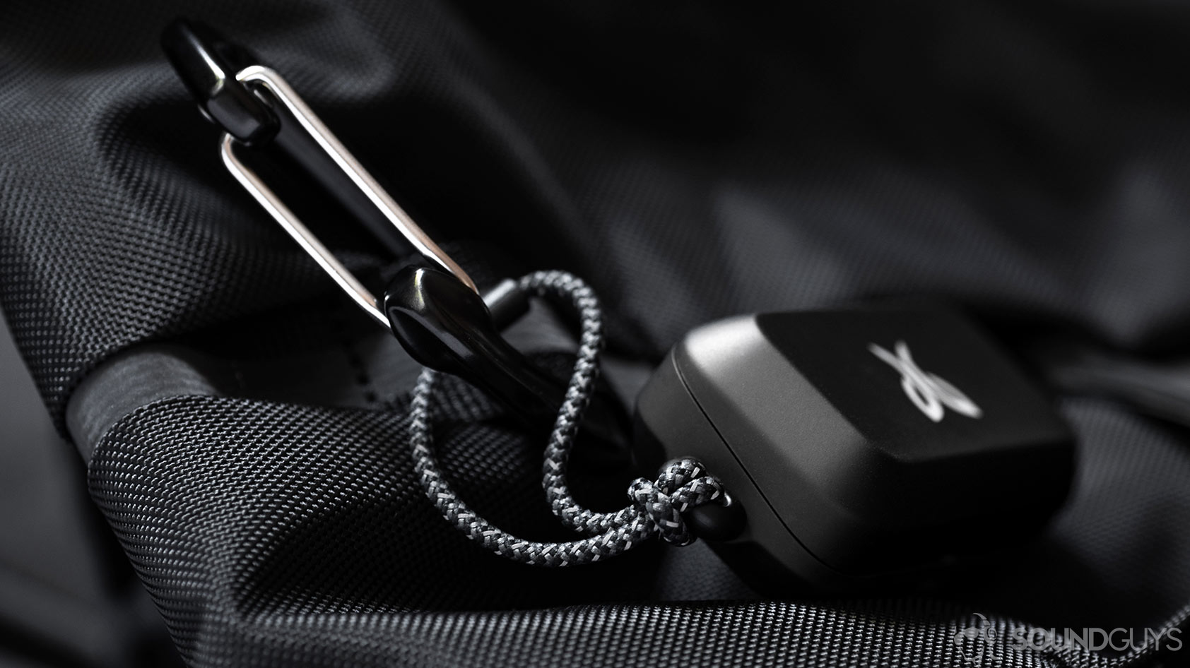 An image of the Jaybird Vista charging case braided loop attached to a carabiner.