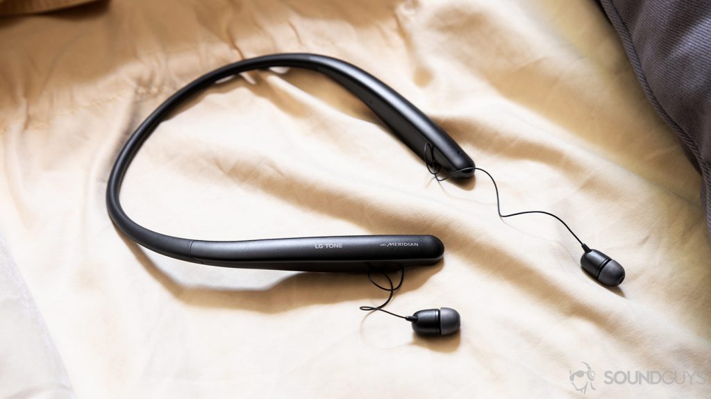LG Tone Style SL5 earbuds extended from the neckband on a yellow surface.