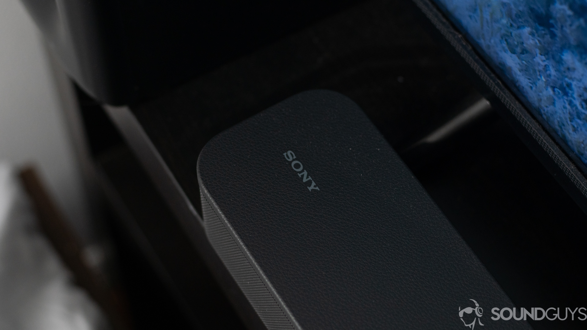 Close-up of sony logo on the Sony HT-S350 soundbar in front of the TV
