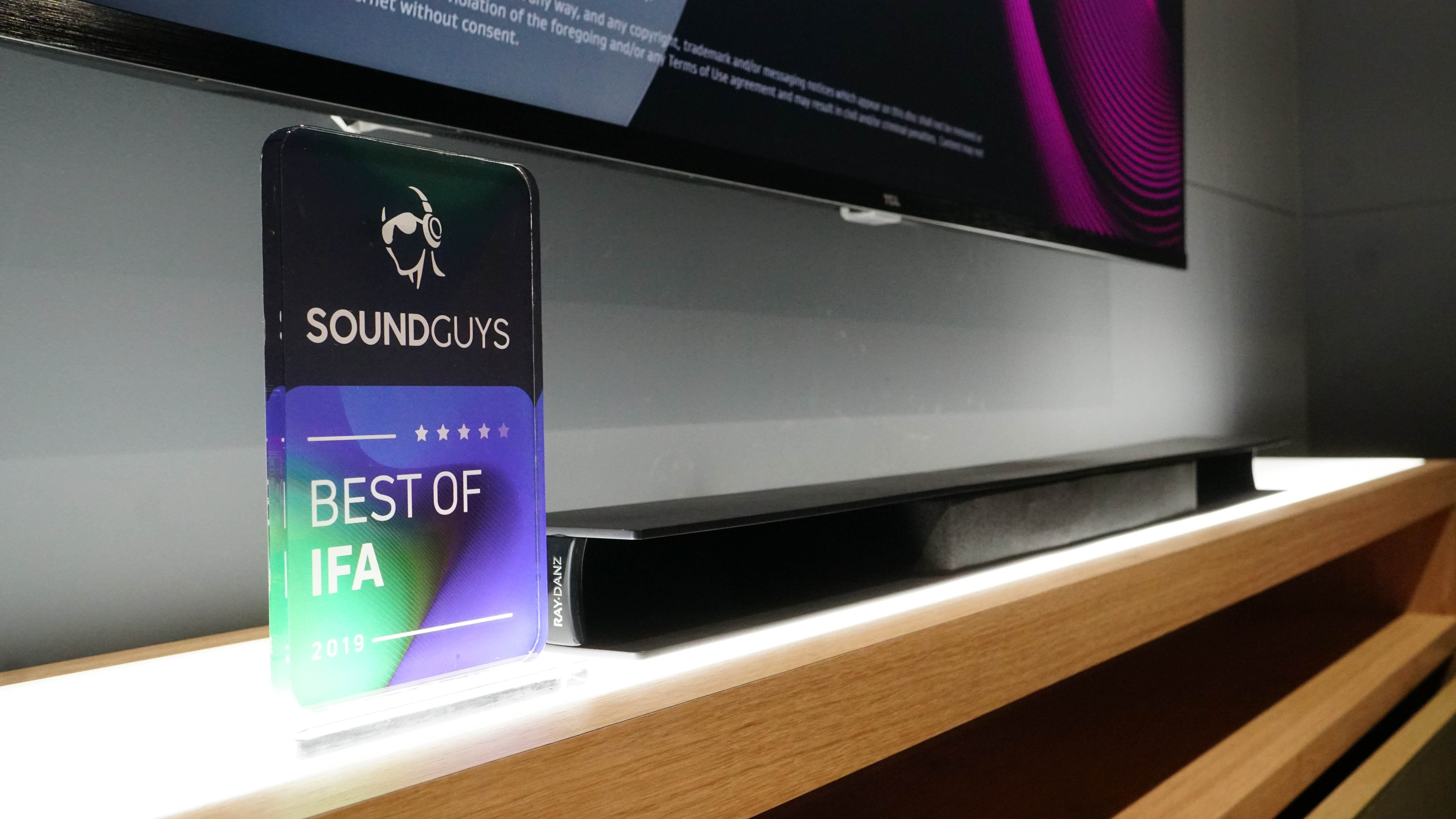 A photo of the SoundGuys best of IFA award next to the TCL RAY-DANZ soundbar.