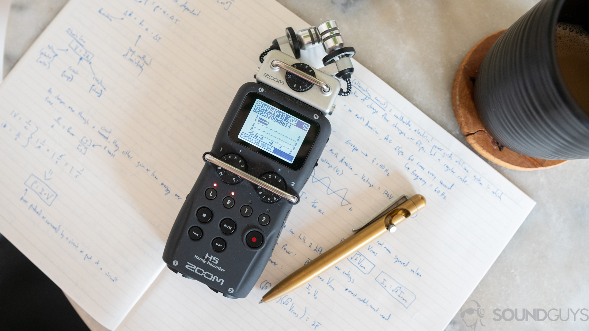 Zoom H5 digital recorder with notebook and pen