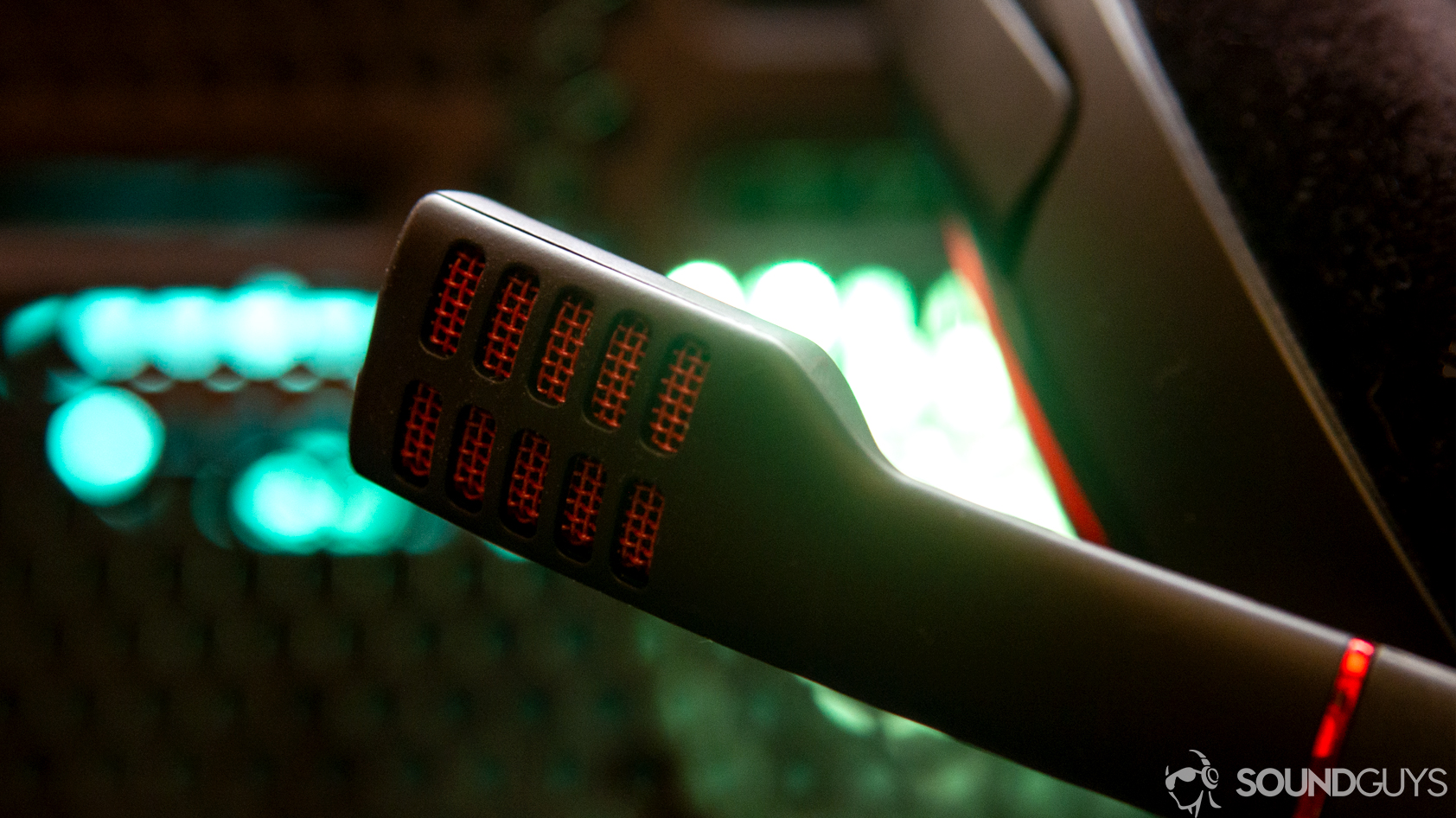 A photo of the Sennheiser Game One's microphone in front of a computer with RGB LED lighting.