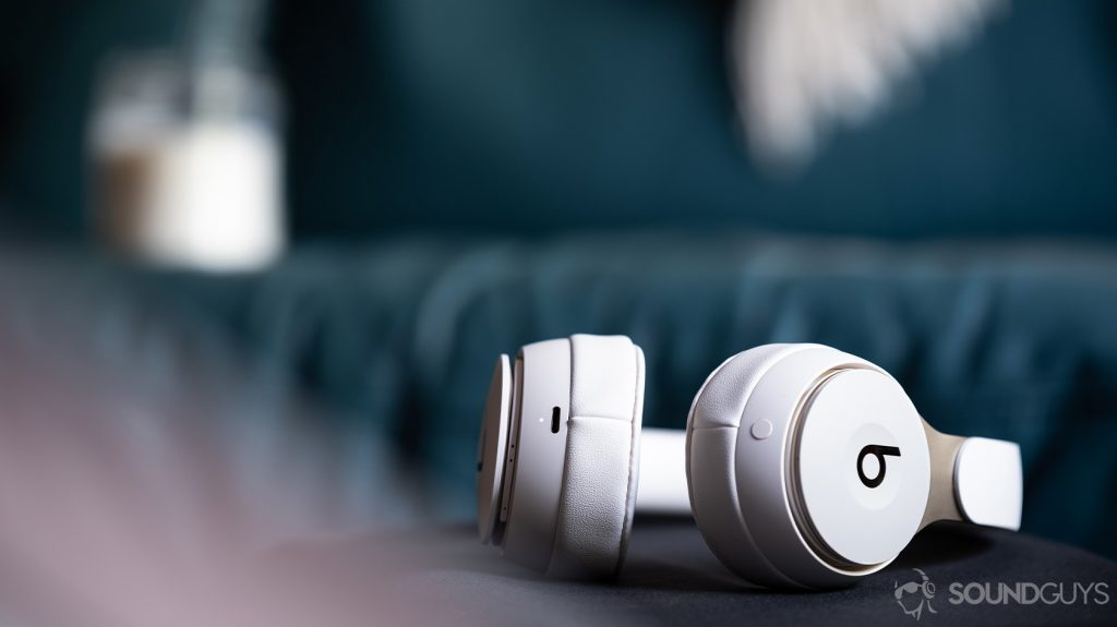 A photo of the Beats Solo Pro on-ear noise cancelling headphones lying on a black surface with the Lightning input in focus.