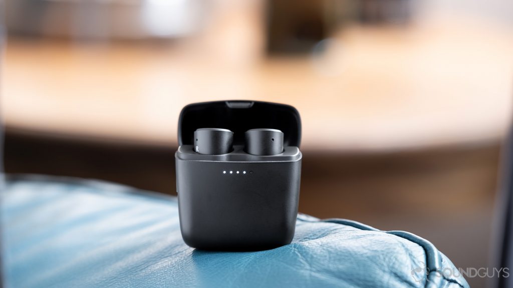 Cambridge Audio Melomania 1 true wireless earbuds in the charging case which is open and standing vertically.
