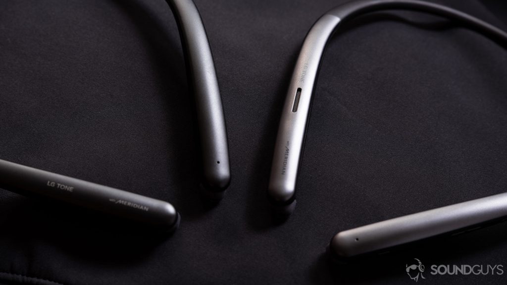 A photo of the LG Tone Style SL6s and SL5 neckband wireless earbuds next to each other and angled on a black surface.