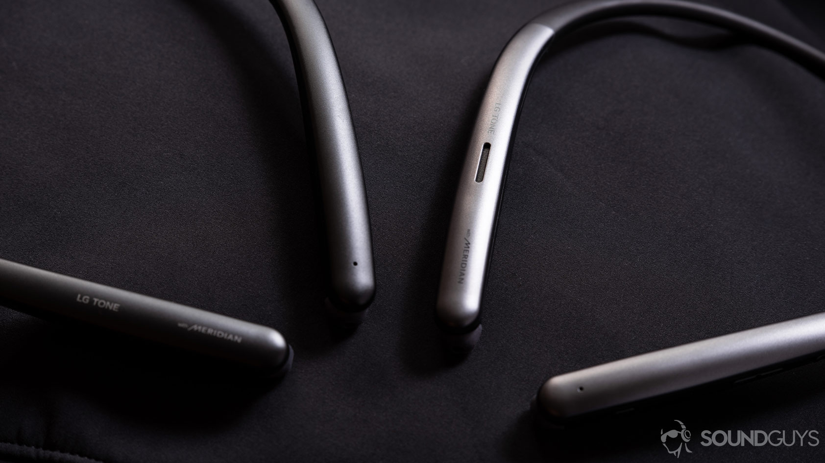LG Tone Style SL6s and SL5 neckband wireless earbuds angled A photo of the LG Tone Style SL6s and SL5 neckband wireless earbuds next to each other and angled on a black surface.
