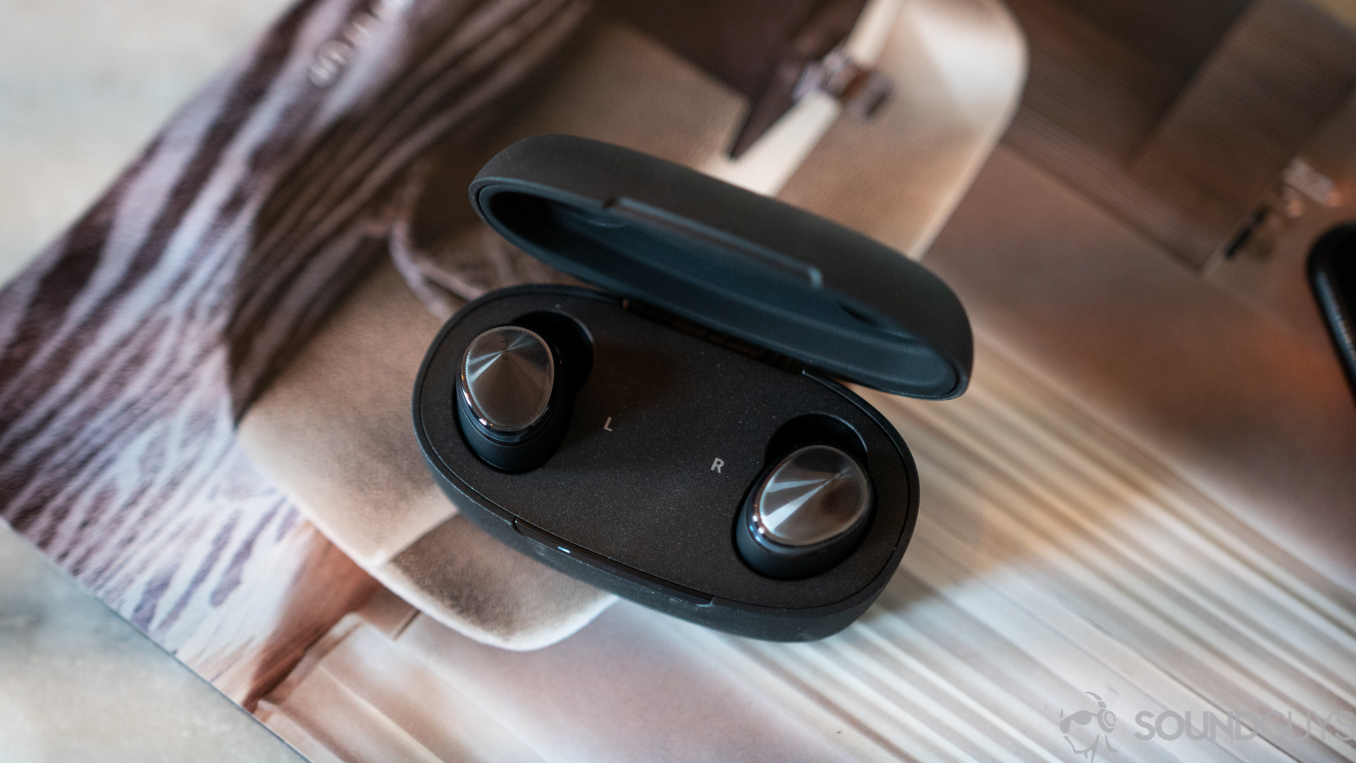 Optoma Be Free6 pictured in charging case Optoma Be Free6 pictured in charging case